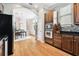 Updated kitchen featuring hardwood floors and stainless steel appliances at 3104 W Fielder St, Tampa, FL 33611