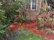 Detailed shot of the landscaped yard featuring a variety of plants and fresh mulch at 3104 W Fielder St, Tampa, FL 33611