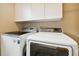 Laundry room with modern Samsung washer and dryer at 3104 W Fielder St, Tampa, FL 33611
