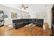 Bright living room with a comfortable sectional sofa and hardwood floors at 3104 W Fielder St, Tampa, FL 33611