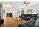 Spacious living room featuring a large sectional sofa, hardwood floors, and plenty of natural light at 3104 W Fielder St, Tampa, FL 33611