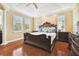 Spacious main bedroom with hardwood floors and large windows at 3104 W Fielder St, Tampa, FL 33611