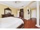 Large main bedroom with hardwood floors and ensuite bathroom at 3104 W Fielder St, Tampa, FL 33611