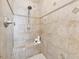 Large walk-in shower with tiled walls and built-in seat at 3104 W Fielder St, Tampa, FL 33611