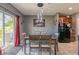 Bright dining area with table and chairs, and access to the kitchen at 409 Serenity Mill Loop, Ruskin, FL 33570