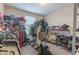 Well-organized closet with hanging rods and shelves at 409 Serenity Mill Loop, Ruskin, FL 33570