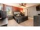 Spacious bedroom with a large bed, nightstands, and a ceiling fan at 409 Serenity Mill Loop, Ruskin, FL 33570