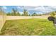 Fenced backyard with grassy lawn and space for grilling at 409 Serenity Mill Loop, Ruskin, FL 33570