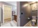 Simple bathroom with toilet and vanity, next to a walk-in closet at 409 Serenity Mill Loop, Ruskin, FL 33570