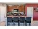 Modern kitchen with an island and dark brown cabinets at 409 Serenity Mill Loop, Ruskin, FL 33570