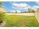 Spacious backyard with a fenced perimeter and grassy lawn at 409 Serenity Mill Loop, Ruskin, FL 33570