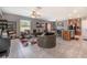 Open living room with L-shaped sectional sofa and access to kitchen at 409 Serenity Mill Loop, Ruskin, FL 33570