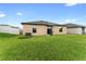 Nice backyard with grill and grassy area at 10005 Caraway Spice Ave, Riverview, FL 33578
