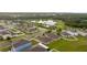 Community overview with houses, pond, and pool at 10005 Caraway Spice Ave, Riverview, FL 33578