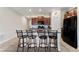 Kitchen island with seating and granite countertop at 10005 Caraway Spice Ave, Riverview, FL 33578