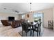 Dining area with chandelier and view of living room at 10005 Caraway Spice Ave, Riverview, FL 33578