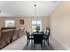 Dining area with chandelier, table, and access to backyard at 10005 Caraway Spice Ave, Riverview, FL 33578
