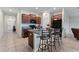 Open kitchen with island and granite countertops at 10005 Caraway Spice Ave, Riverview, FL 33578