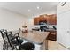 Kitchen island with seating and granite countertop at 10005 Caraway Spice Ave, Riverview, FL 33578