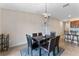 Dining room with chandelier and view of kitchen at 10005 Caraway Spice Ave, Riverview, FL 33578