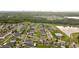 Aerial view of a residential neighborhood with a community pool and houses at 10005 Caraway Spice Ave, Riverview, FL 33578