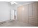 Carpeted bedroom with spacious built-in wardrobe cabinets and drawers at 11230 Heathrow Ave, Spring Hill, FL 34609