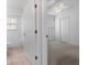 Carpeted bedroom with doorway to bathroom, perfect for a primary suite at 11230 Heathrow Ave, Spring Hill, FL 34609