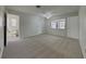 Large bedroom with a ceiling fan, neutral carpet, and ample closet space at 2607 Royal Ridge Dr, Spring Hill, FL 34606