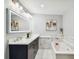 Elegant bathroom with marble accents, double vanity, large mirror, and soaking tub at 912 Channelside Dr # 2316, Tampa, FL 33602