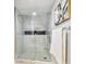 Modern glass shower with tiled walls, contrasting accents, and chrome shower fixtures at 912 Channelside Dr # 2316, Tampa, FL 33602