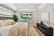 Bright bedroom featuring a large window, neutral tones, and a decorative accent wall at 912 Channelside Dr # 2316, Tampa, FL 33602