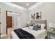 Well-lit bedroom featuring neutral walls, modern lighting, stylish furnishings, and wood-look floors at 912 Channelside Dr # 2316, Tampa, FL 33602