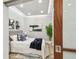 Cozy bedroom featuring tray ceilings, neutral walls, and decorative throw pillows and blankets at 912 Channelside Dr # 2316, Tampa, FL 33602