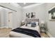 Well-lit bedroom featuring neutral walls, modern lighting, stylish furnishings, and wood-look floors at 912 Channelside Dr # 2316, Tampa, FL 33602
