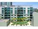Multi-story modern condo building with balconies, lush landscaping, and city views at 912 Channelside Dr # 2316, Tampa, FL 33602