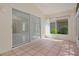 Peaceful sunroom with tile flooring and access to backyard at 11230 Heathrow Ave, Spring Hill, FL 34609