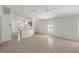 Living room features tile flooring and a ceiling fan at 11230 Heathrow Ave, Spring Hill, FL 34609