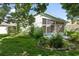 Backyard view of house with a large screened porch at 11230 Heathrow Ave, Spring Hill, FL 34609