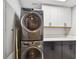 Laundry room with stacked washer and dryer, and cabinetry at 912 Channelside Dr # 2316, Tampa, FL 33602