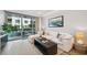 Bright living room with a comfortable sectional sofa and access to a balcony at 912 Channelside Dr # 2316, Tampa, FL 33602