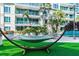 Relaxing courtyard with hammock, lush landscaping, and a resort-style pool at 912 Channelside Dr # 2316, Tampa, FL 33602