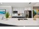 Modern kitchen with white cabinets, quartz counters, and stainless steel appliances at 912 Channelside Dr # 2316, Tampa, FL 33602