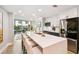 Modern kitchen with white quartz counters and stainless steel appliances at 912 Channelside Dr # 2316, Tampa, FL 33602