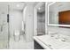 Modern bathroom with a glass shower, white tile, and updated vanity at 912 Channelside Dr # 2316, Tampa, FL 33602