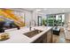 Modern kitchen with a large island and stainless steel appliances at 912 Channelside Dr # 2316, Tampa, FL 33602