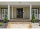 Elegant front door entrance with a large porch at 638 Limona Woods Dr, Brandon, FL 33510