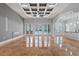 Spacious living room featuring high ceilings, marble floors, and French doors leading to the backyard at 638 Limona Woods Dr, Brandon, FL 33510