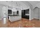 Modern kitchen with two-toned cabinetry, large island, and high-end appliances at 638 Limona Woods Dr, Brandon, FL 33510