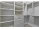 Large walk-in closet with ample shelving and drawers at 638 Limona Woods Dr, Brandon, FL 33510