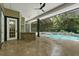 Relaxing pool and spa area with a covered patio and outdoor kitchen at 638 Limona Woods Dr, Brandon, FL 33510